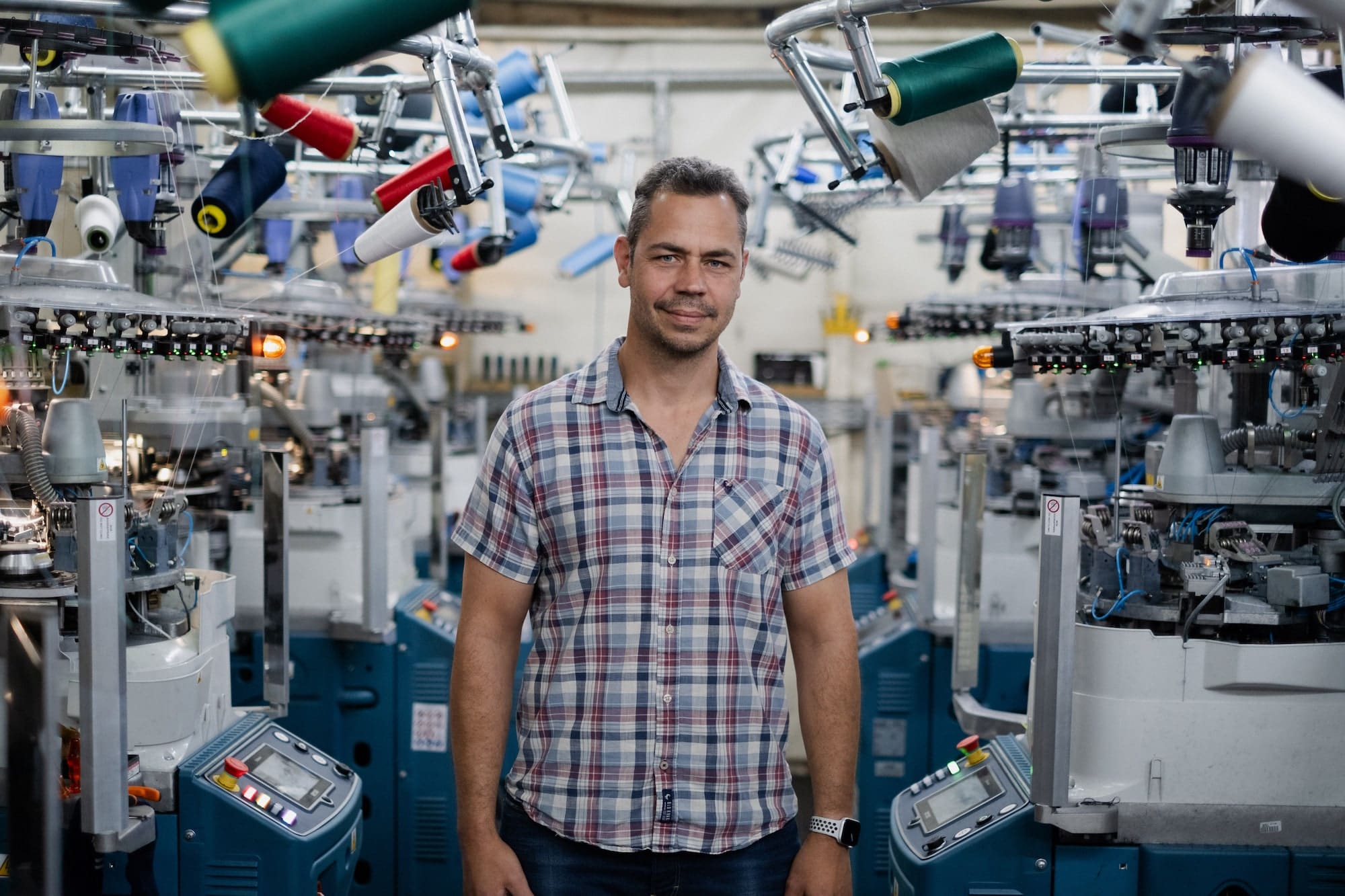 Kalven Armstrong standing in the Gilnokie Sock factory in Pinetown South Africa.